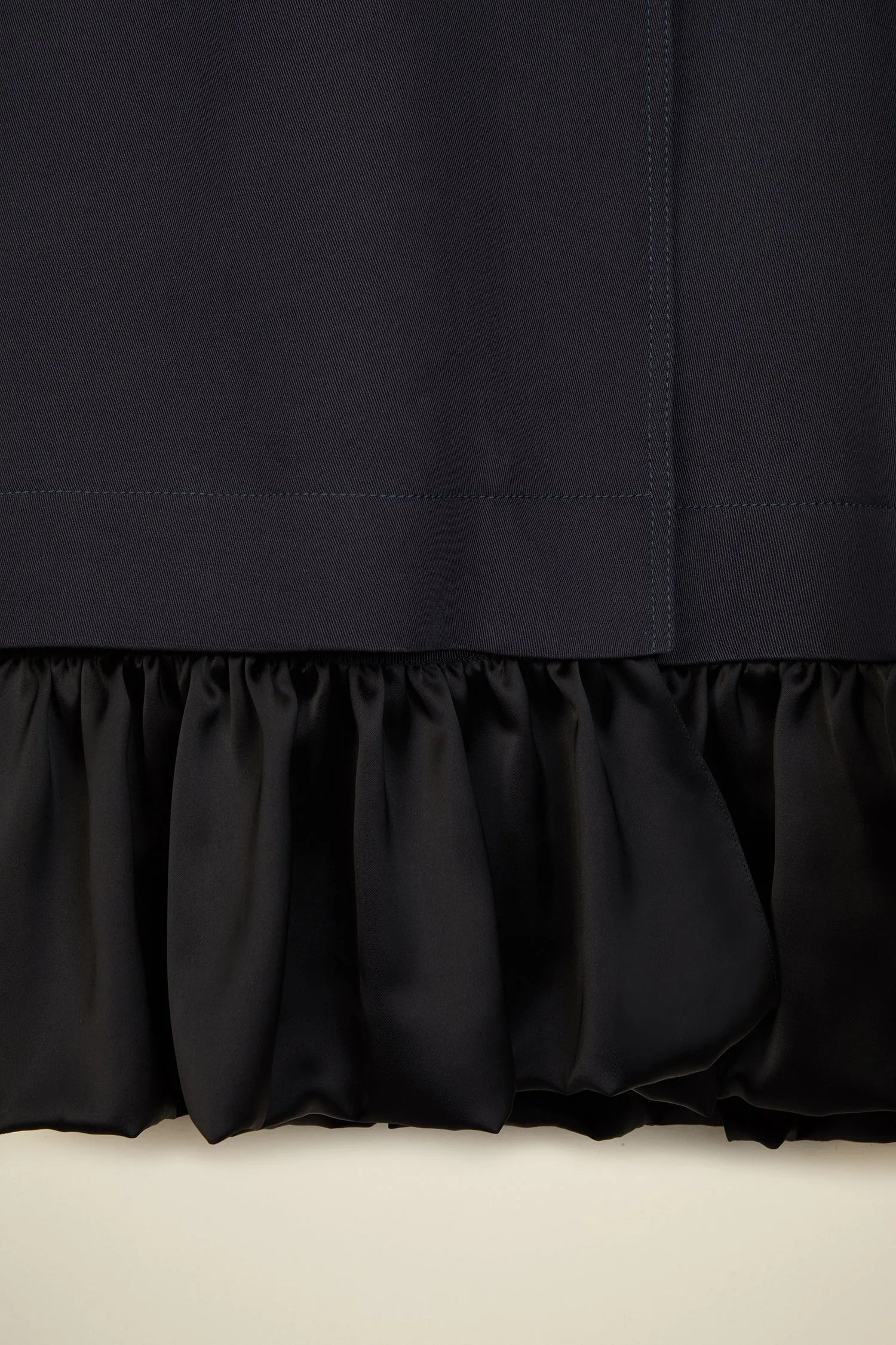 Ruffle hem gabardine coat